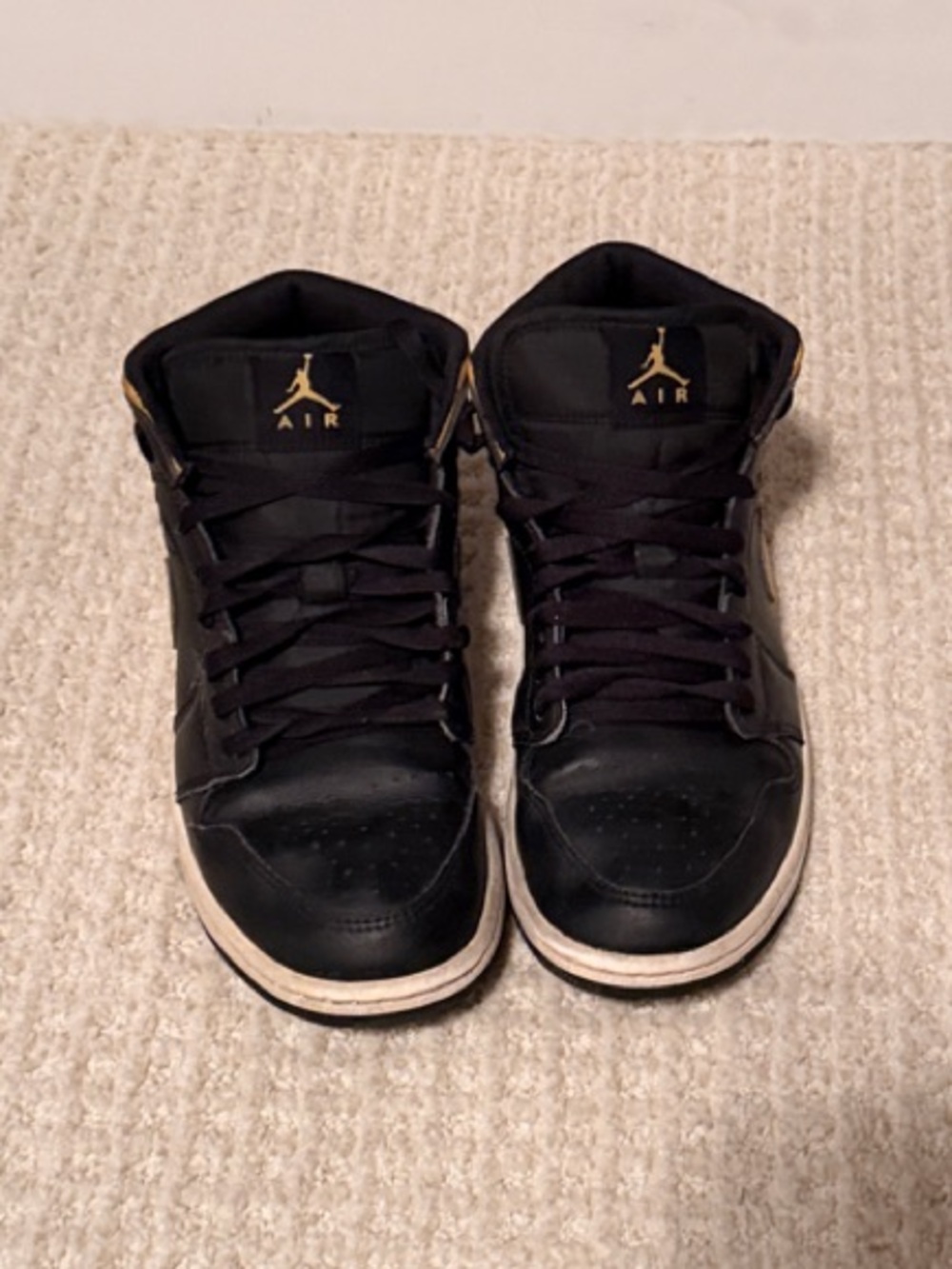 Jordan Black and Gold High-Top Sneakers